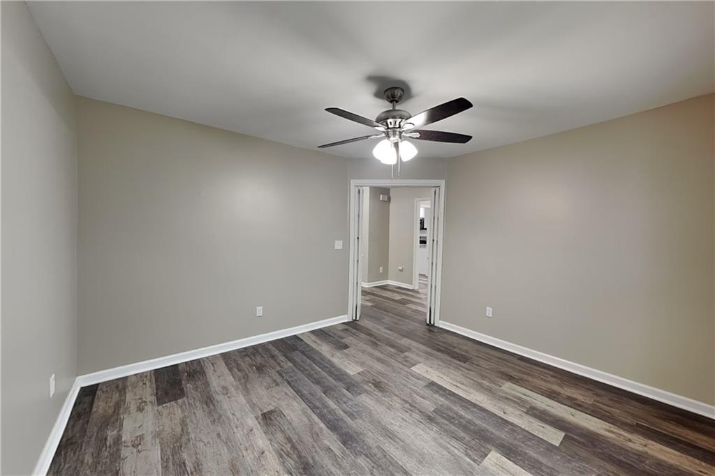 6072 Devonshire Drive Flowery Branch, GA 30542 - Photo 2 of 22 wooden floor in an empty room