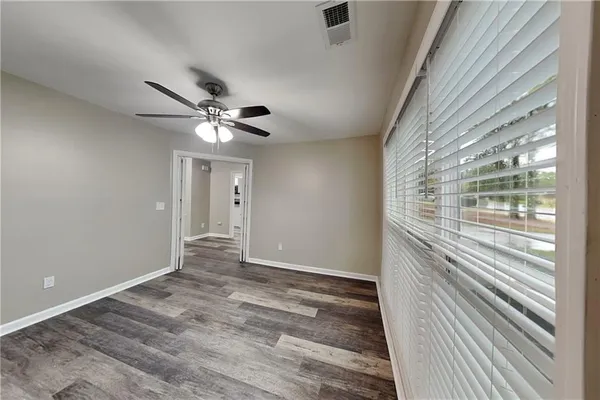 a view of an empty room with a window