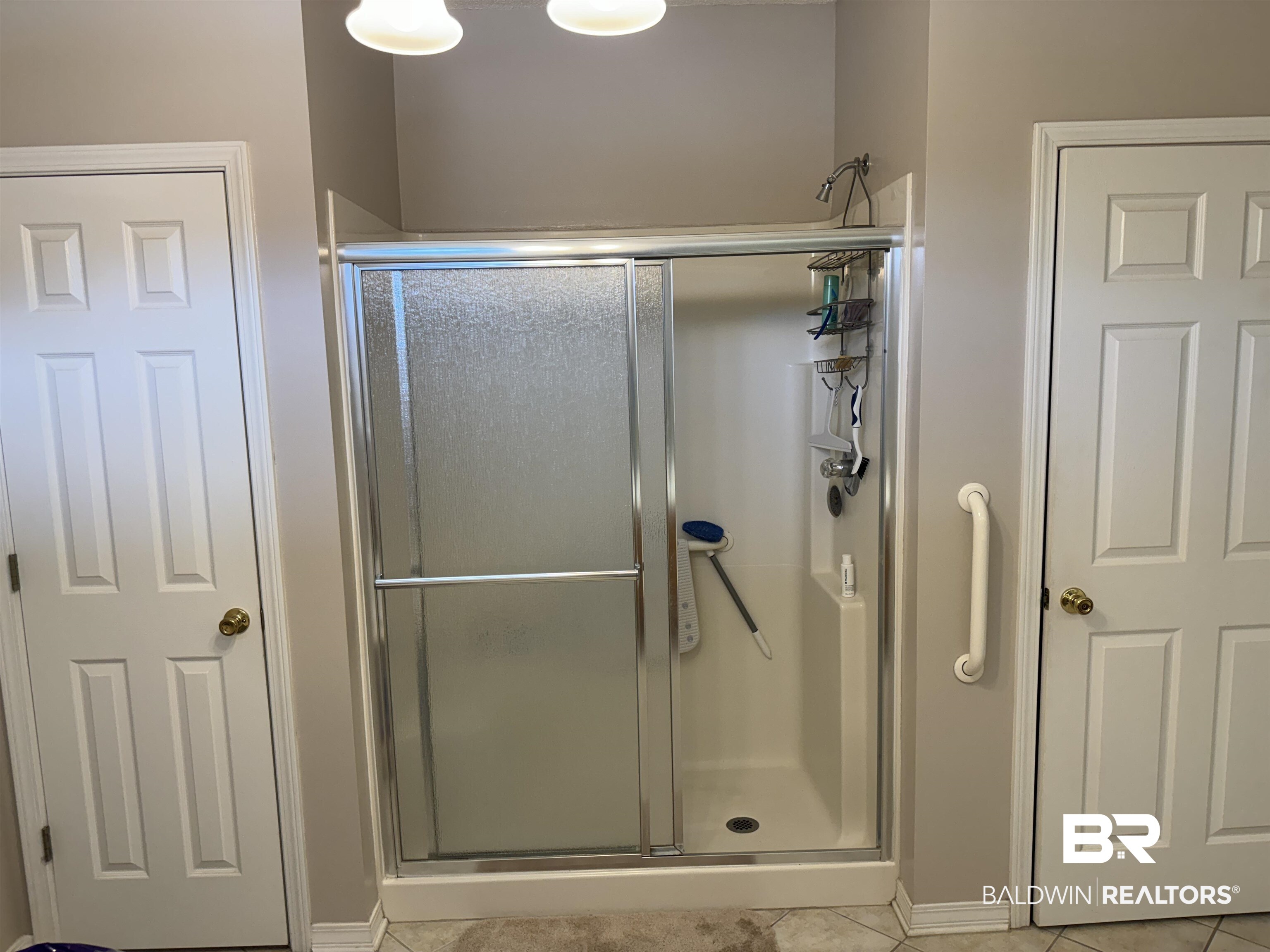 9139 Clubhouse Drive Foley, AL 36535 - Photo 23 of 30 Bathroom with tile patterned floors and an enclosed shower