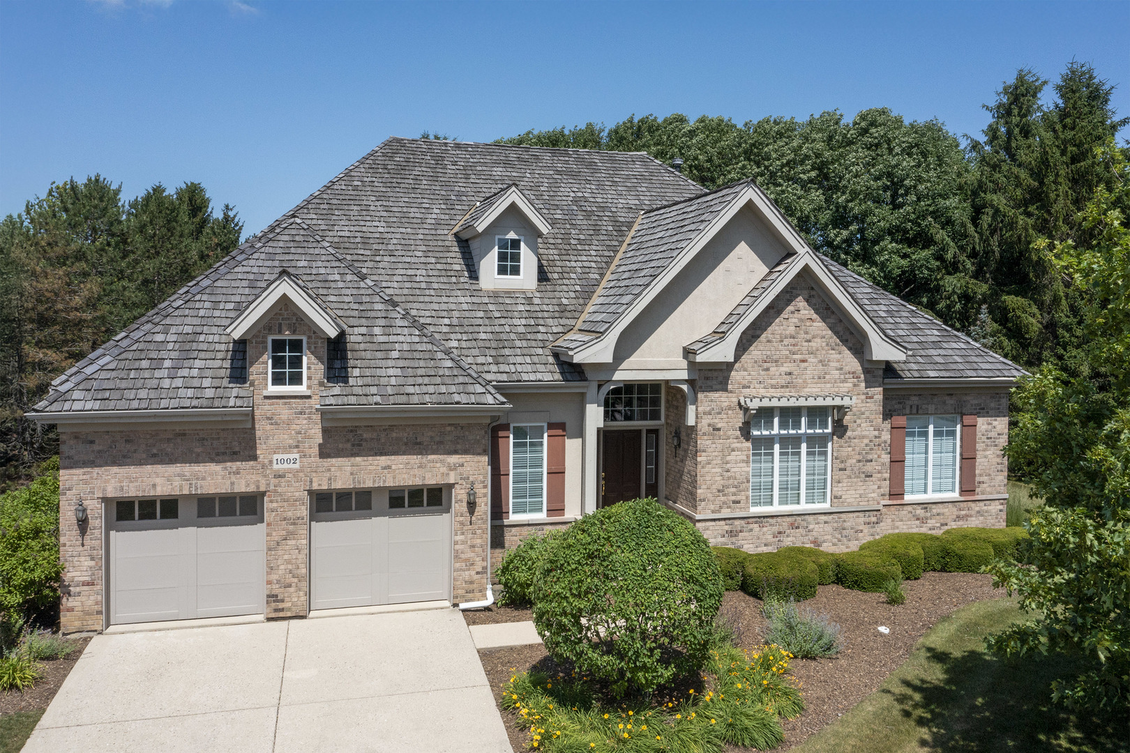 1002 Ridgeview Drive Inverness, IL 60010 - Photo 1 of 34 a house view with a outdoor space