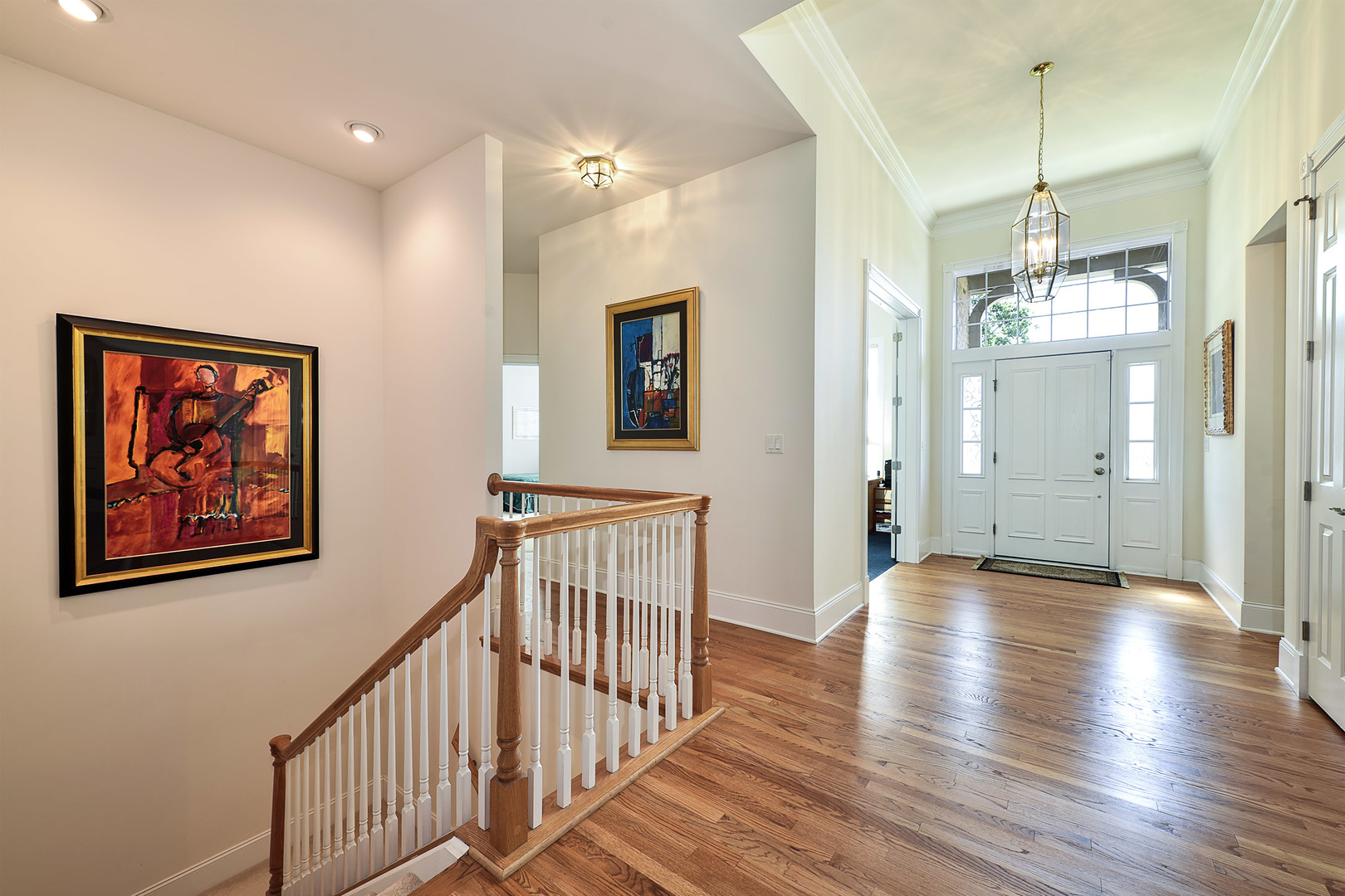 1002 Ridgeview Drive Inverness, IL 60010 - Photo 2 of 34 a view of a hallway with wooden floor and staircase
