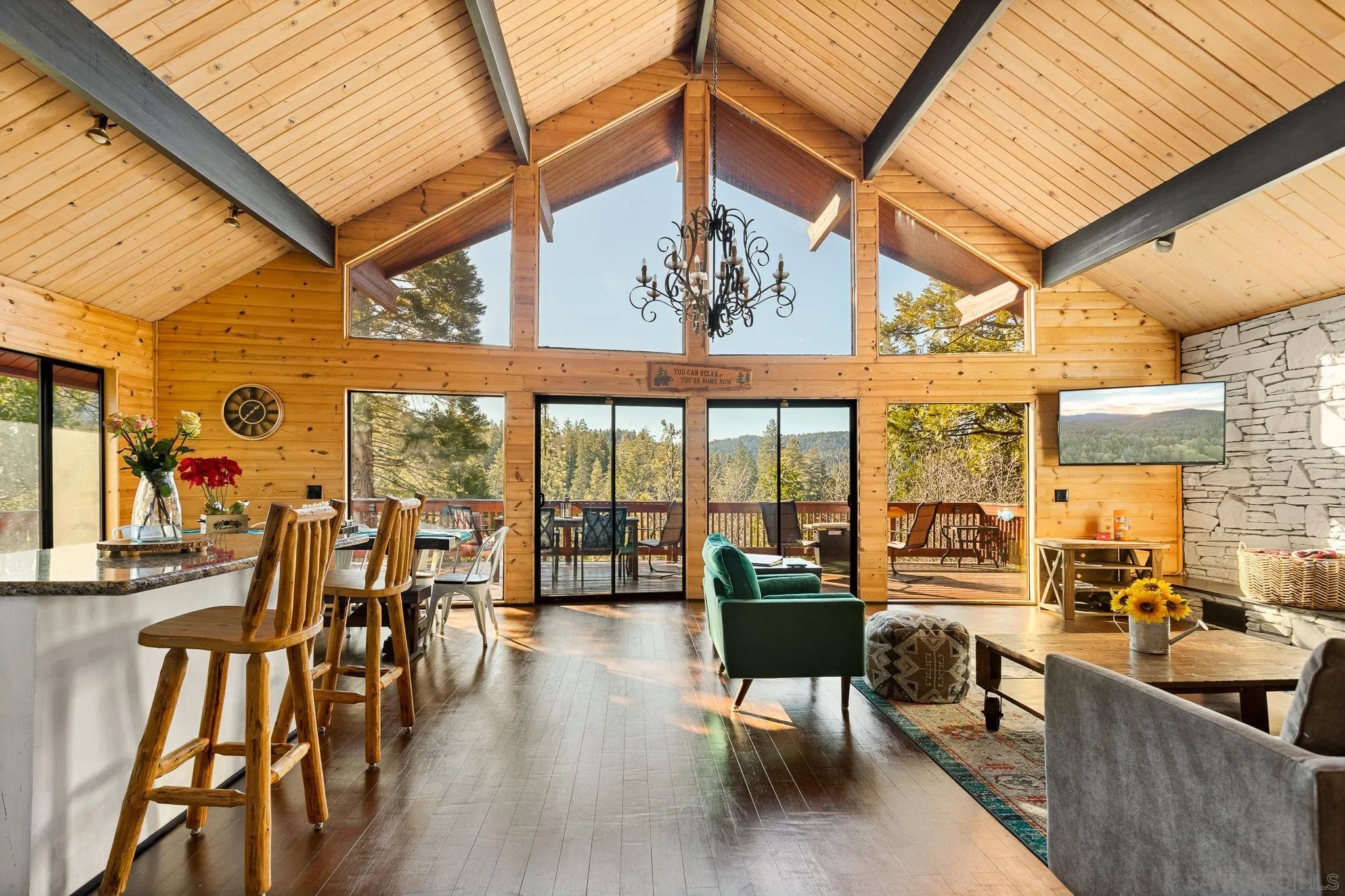 683 Grass Valley Road Lake Arrowhead, CA 92352 - Photo 11 of 39 a view of a patio with dining table and chairs