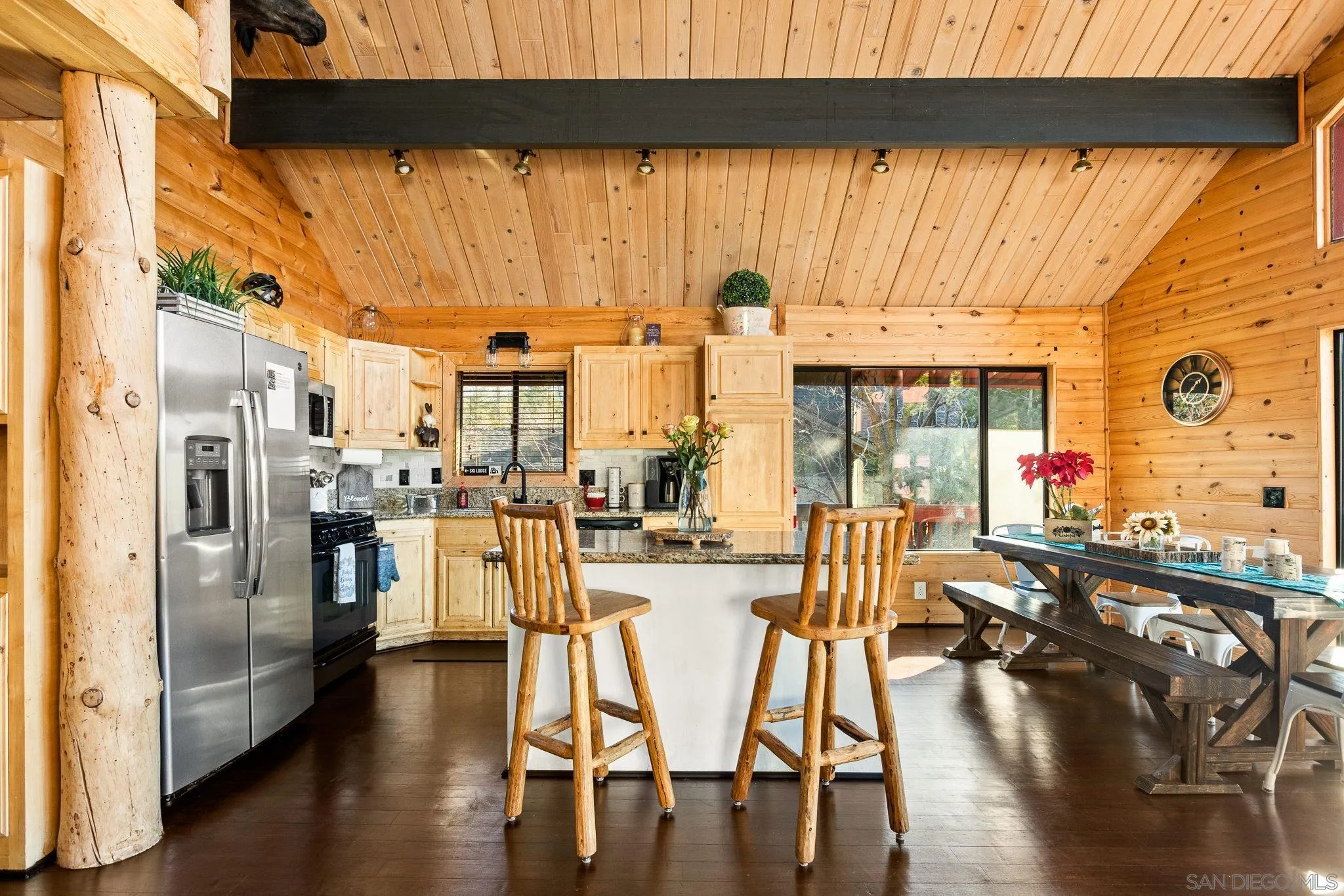 683 Grass Valley Road Lake Arrowhead, CA 92352 - Photo 13 of 39 a view of a dining room with furniture window and wooden floor