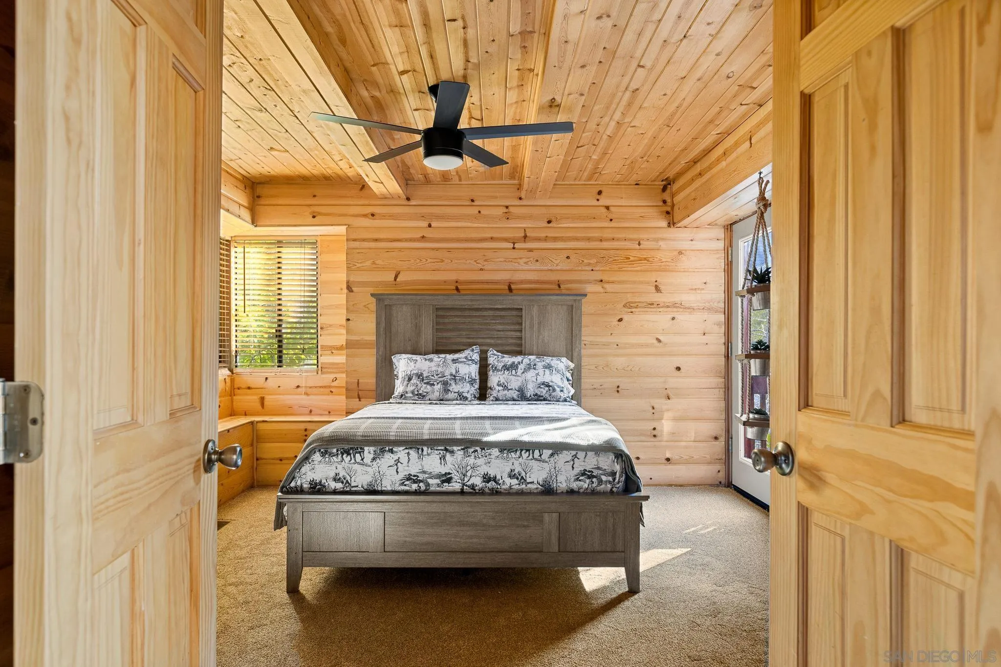 683 Grass Valley Road Lake Arrowhead, CA 92352 - Photo 17 of 39 a bedroom with a bed and a window