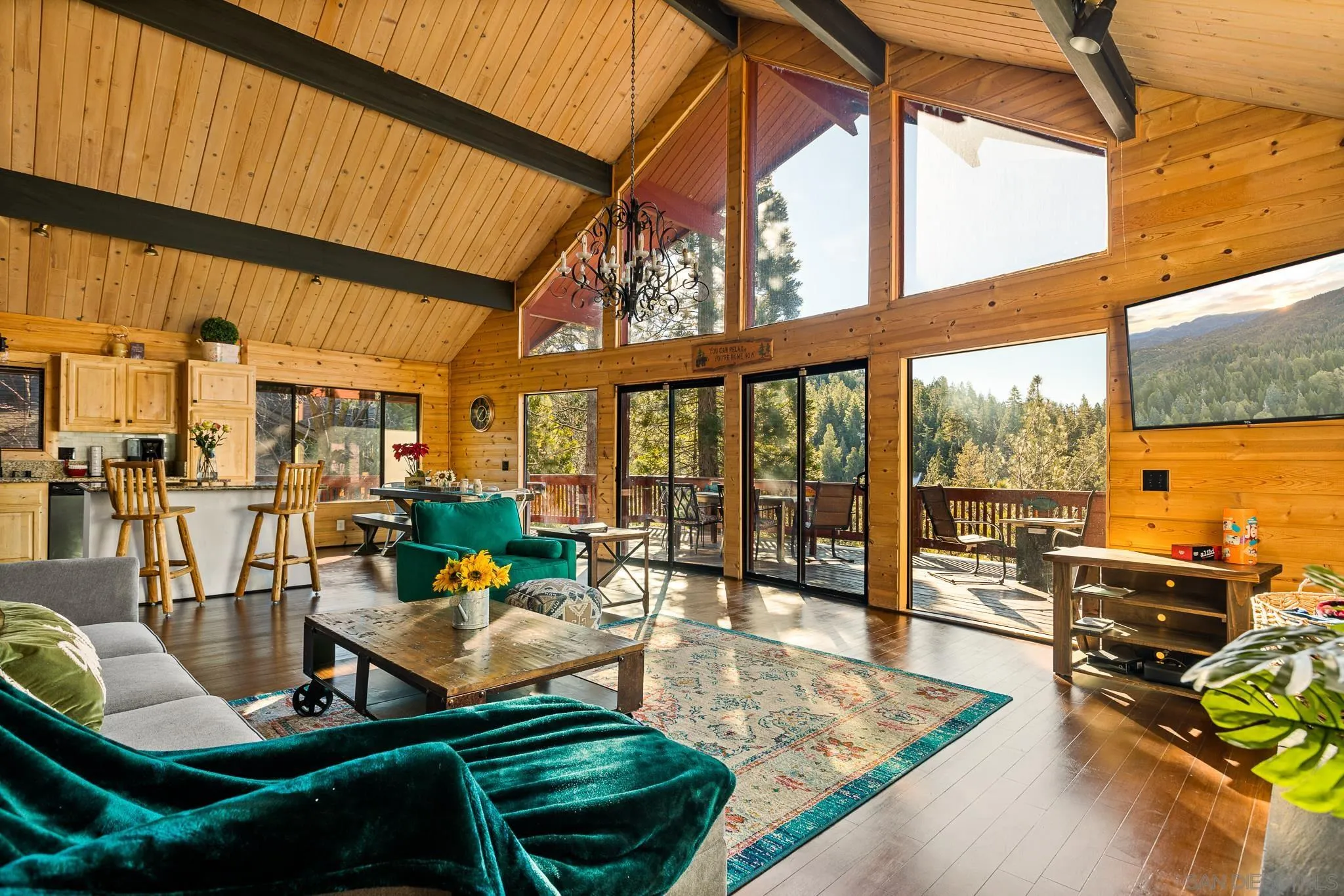 683 Grass Valley Road Lake Arrowhead, CA 92352 - Photo 2 of 39 a living room with furniture next to a large window