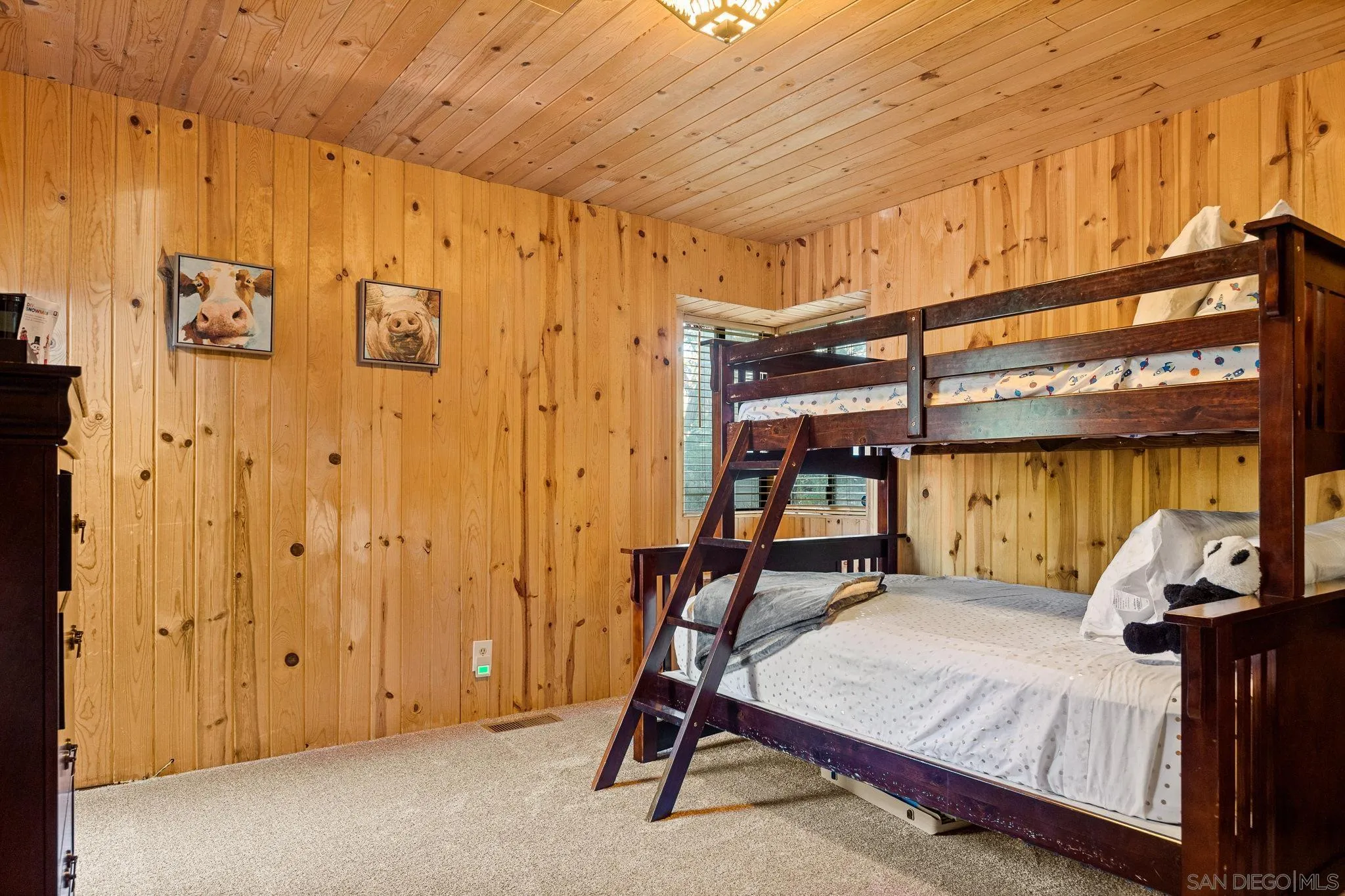 683 Grass Valley Road Lake Arrowhead, CA 92352 - Photo 22 of 39 a bedroom with a bed and a walk in closet