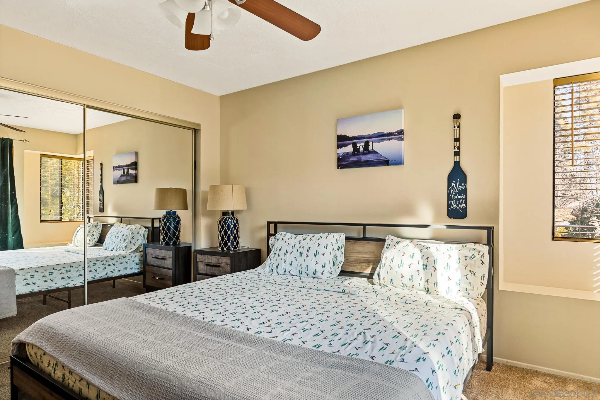 683 Grass Valley Road Lake Arrowhead, CA 92352 - Photo 25 of 39 a bedroom with a bed and wooden floor