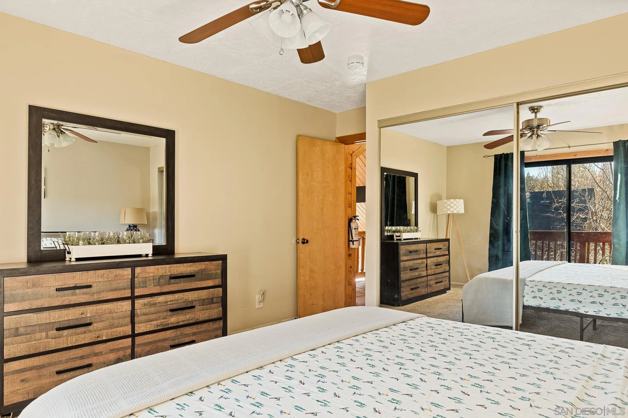 683 Grass Valley Road Lake Arrowhead, CA 92352 - Photo 26 of 39 a bedroom with a bed and a dresser