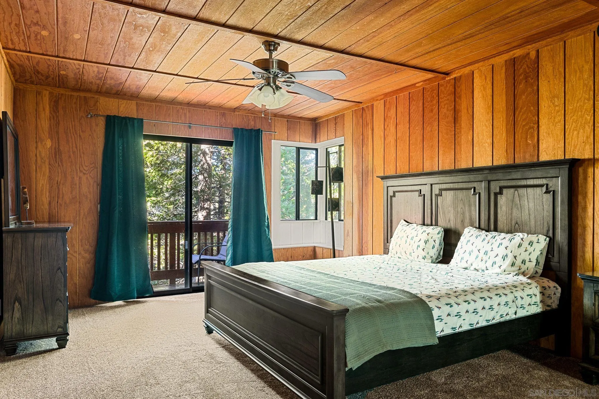 683 Grass Valley Road Lake Arrowhead, CA 92352 - Photo 29 of 39 a bedroom with a bed and a chandelier