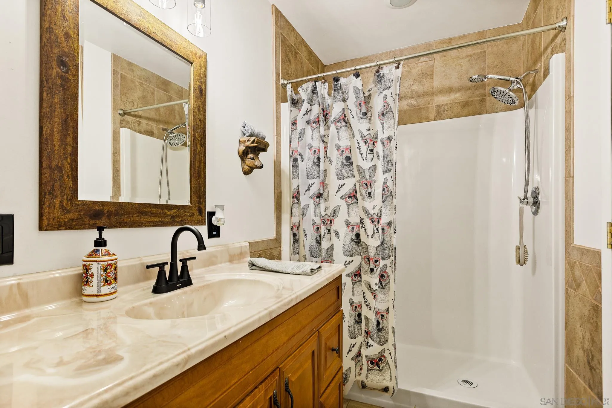 683 Grass Valley Road Lake Arrowhead, CA 92352 - Photo 35 of 39 a bathroom with a sink and a mirror