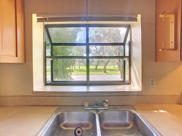 a bathroom with a sink and a window