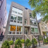 a view of a building next to a yard