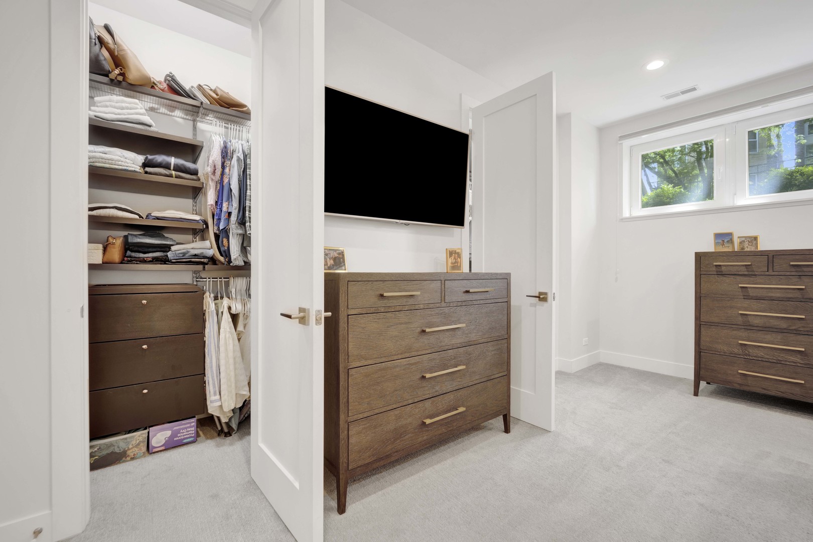 2140 West Rice Street, Unit 1W Chicago, IL 60622 - Photo 11 of 25 a room with furniture a flat screen tv and dresser