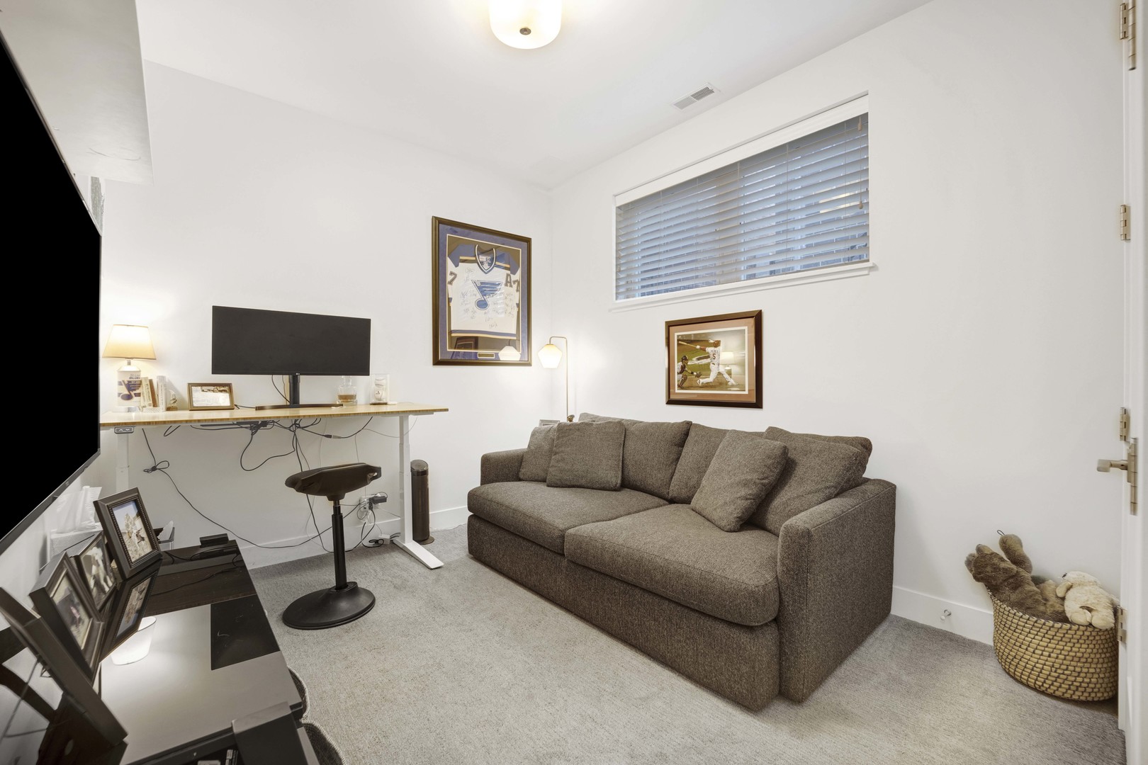 2140 West Rice Street, Unit 1W Chicago, IL 60622 - Photo 18 of 25 a living room with furniture and a flat screen tv