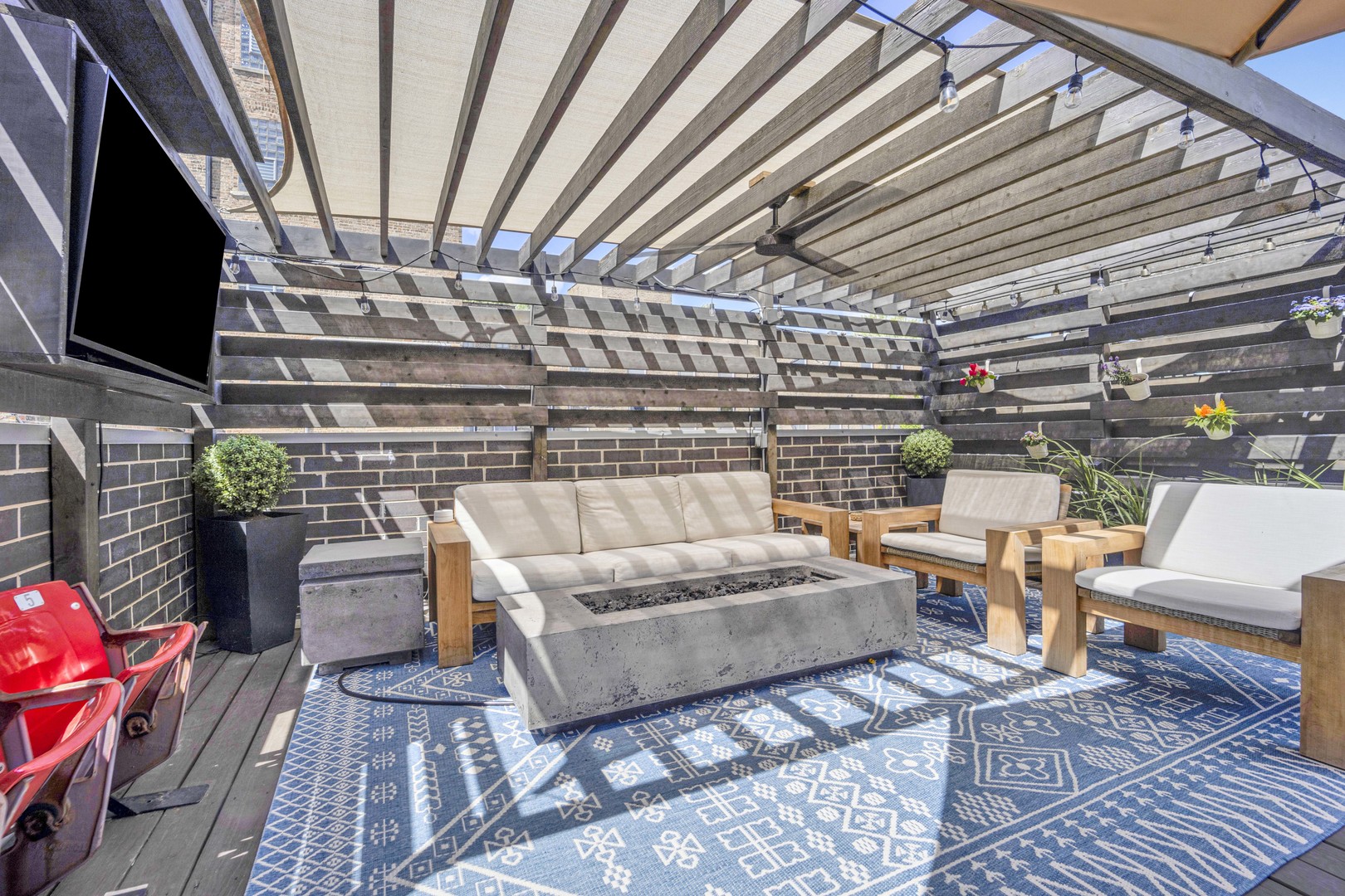 2140 West Rice Street, Unit 1W Chicago, IL 60622 - Photo 22 of 25 a living room with furniture and a flat screen tv