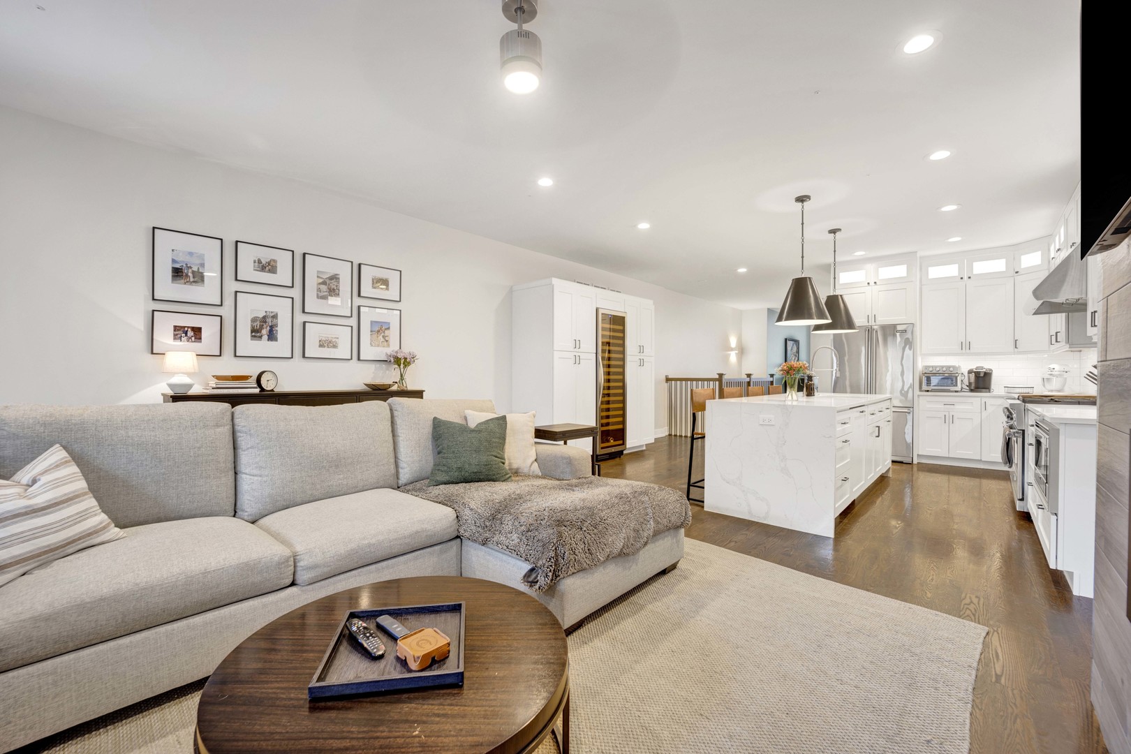 2140 West Rice Street, Unit 1W Chicago, IL 60622 - Photo 4 of 25 a living room with furniture and a view of kitchen
