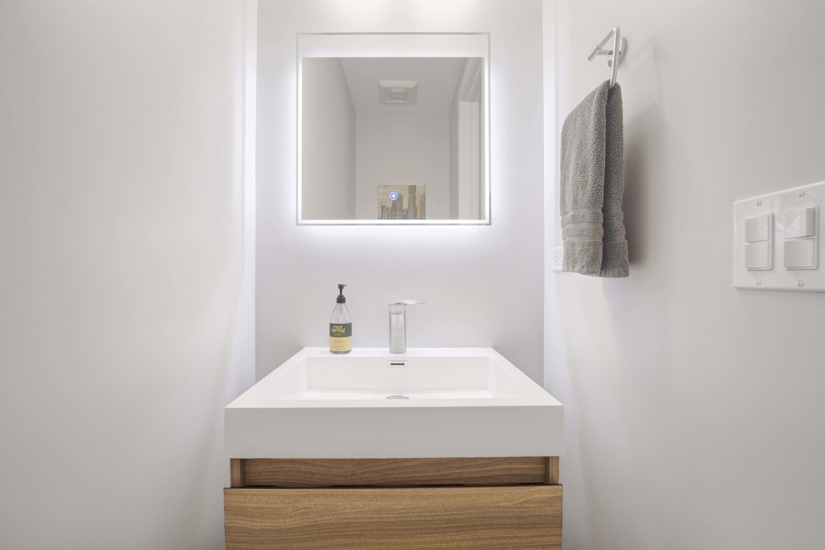 2140 West Rice Street, Unit 1W Chicago, IL 60622 - Photo 8 of 25 a bathroom with a sink and a mirror