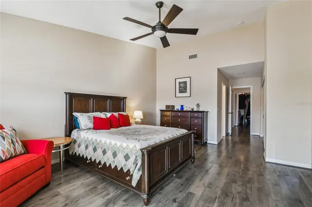 a view of a workspace with furniture and wooden floor