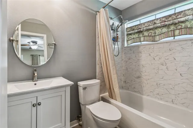 a bathroom with a toilet and a sink