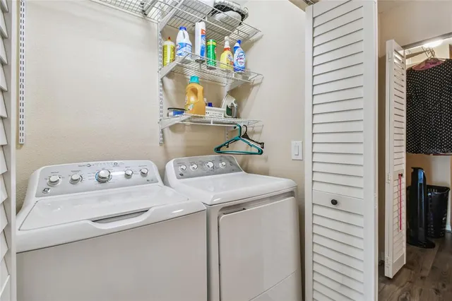 a view of swimming pool with outdoor seating and city view