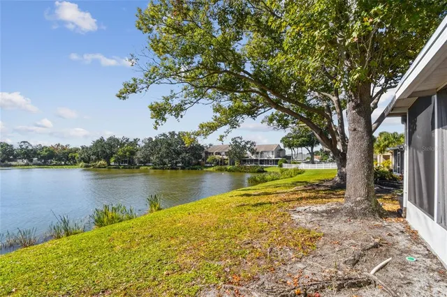 an aerial view of city and lake