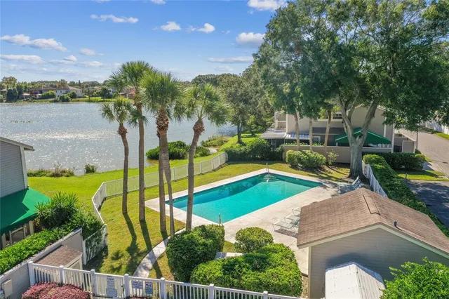 a view of house with garden space and sitting space