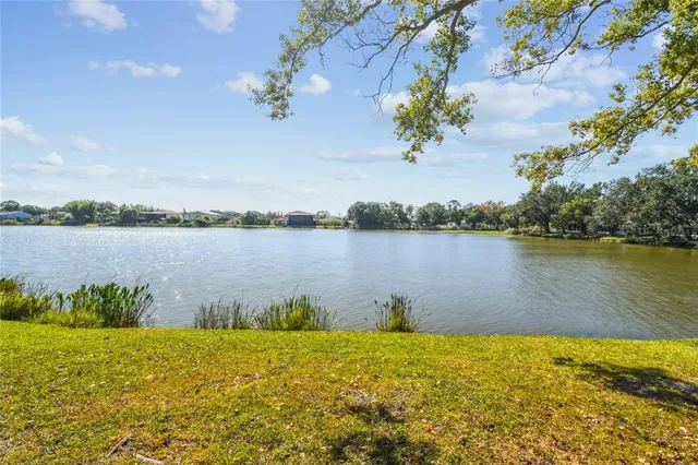 a kitchen with stainless steel appliances granite countertop a refrigerator stove and sink