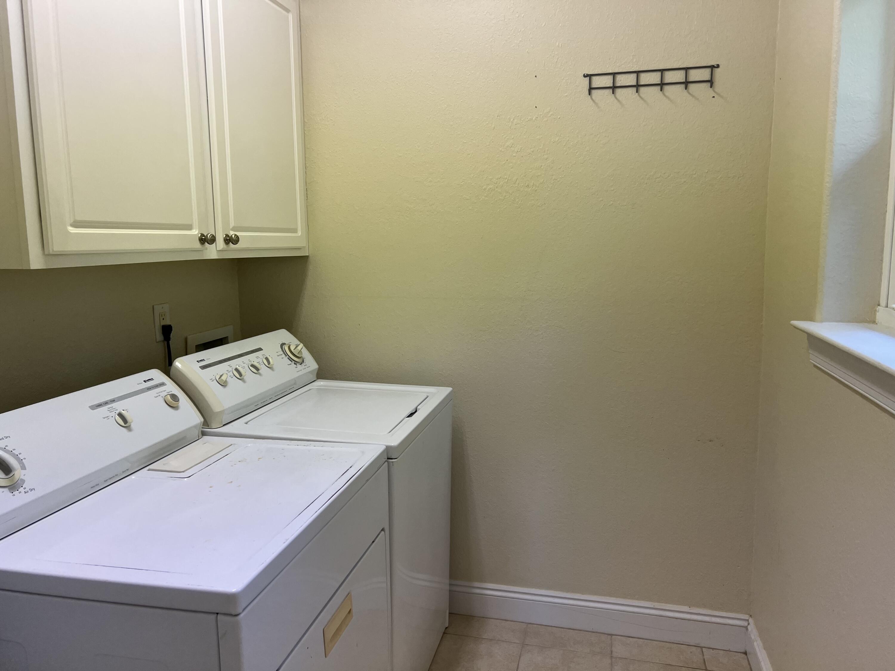 118 Spires Lane, Unit 5B Santa Rosa Beach, FL 32459 - Photo 13 of 28 a utility room with dryer and washer