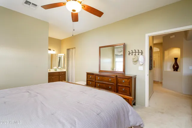 a large bathroom with a tub and sink