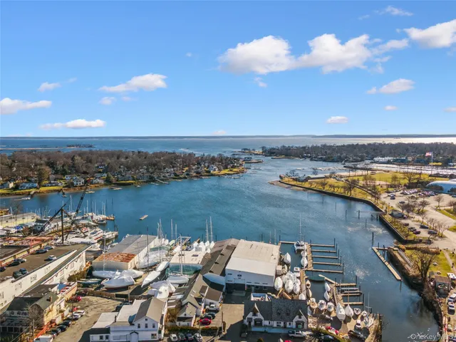 an aerial view of residential building and ocean