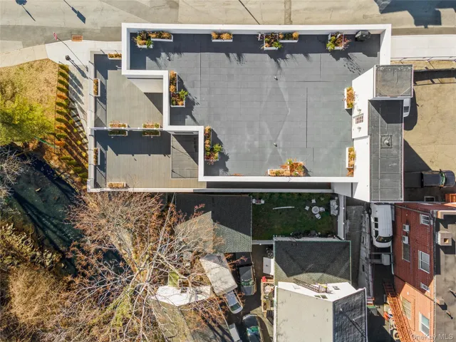 an aerial view of residential building and lake