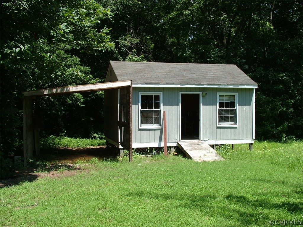 7401 Narrowridge Road Henrico, VA 23231 - Photo 4 of 23 storage shed has lean-to on side and attached stor