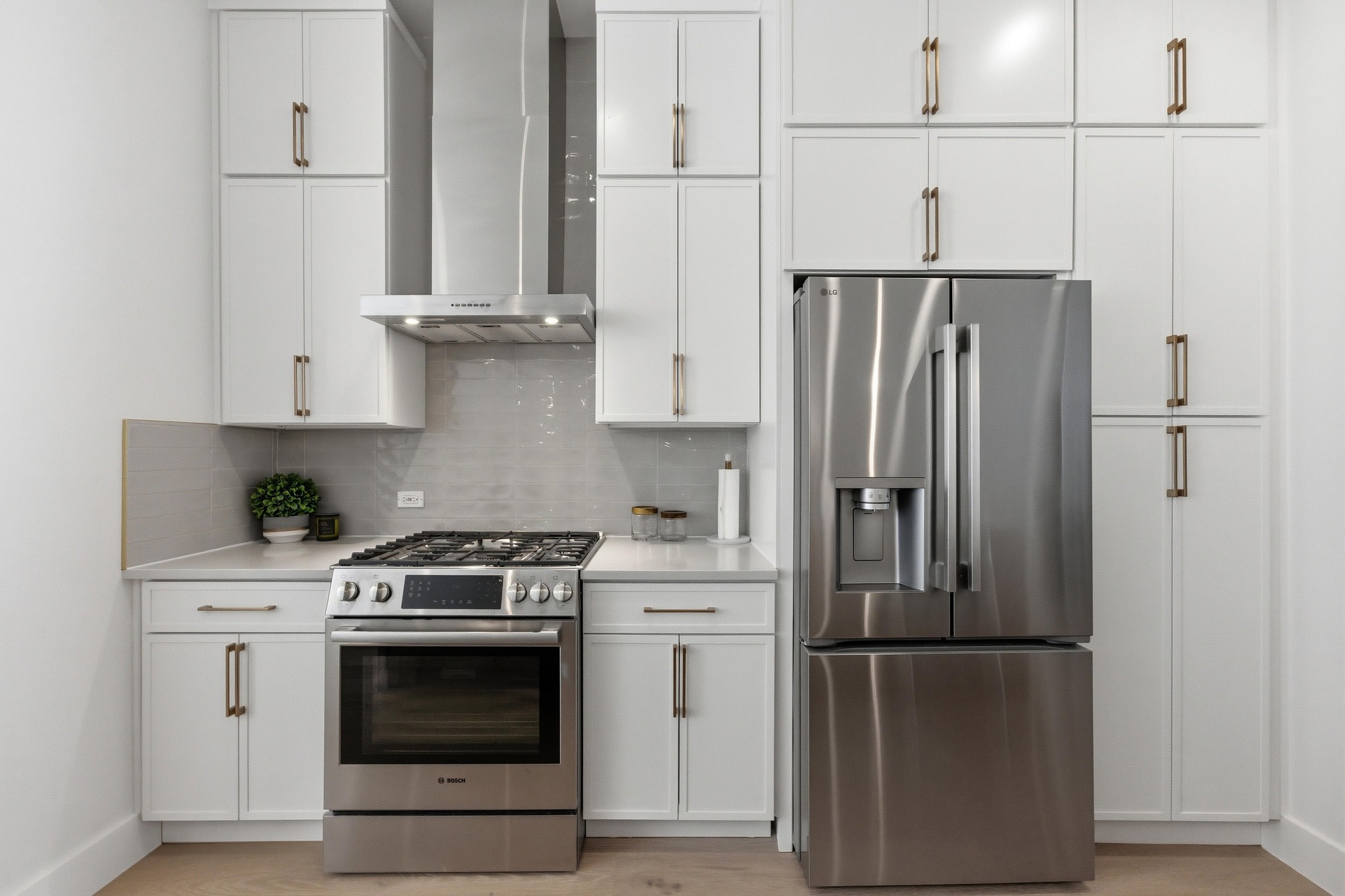 3905 Emory Peak Pass Austin, TX 78731 - Photo 9 of 40 a kitchen with appliances a refrigerator and cabinets