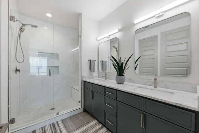 a bedroom with a bed tv and a window