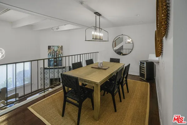 a view of a dining room with furniture window and chandelier