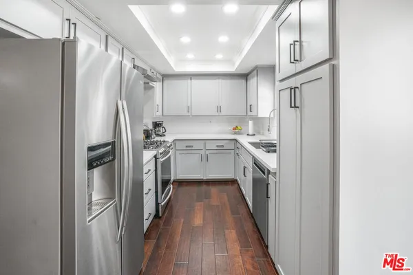 a kitchen with a refrigerator a sink and dishwasher