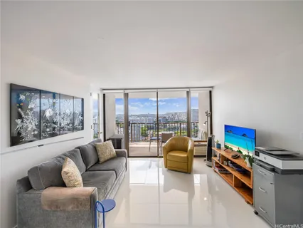 a living room with furniture and a large window