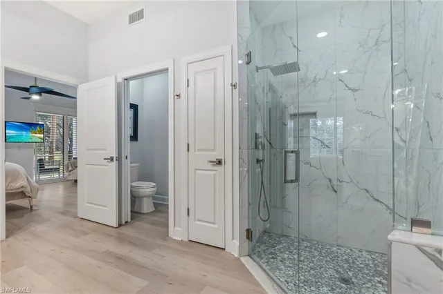 a bathroom with a shower and a sink