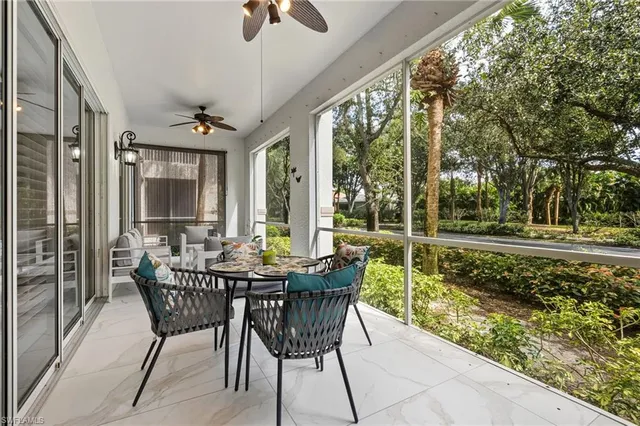a view of a patio with a table and chairs