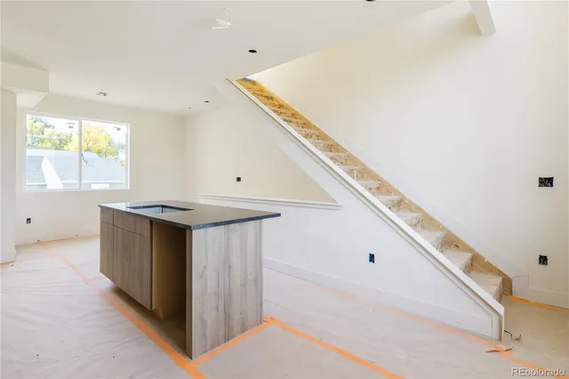 a kitchen with a sink and a window