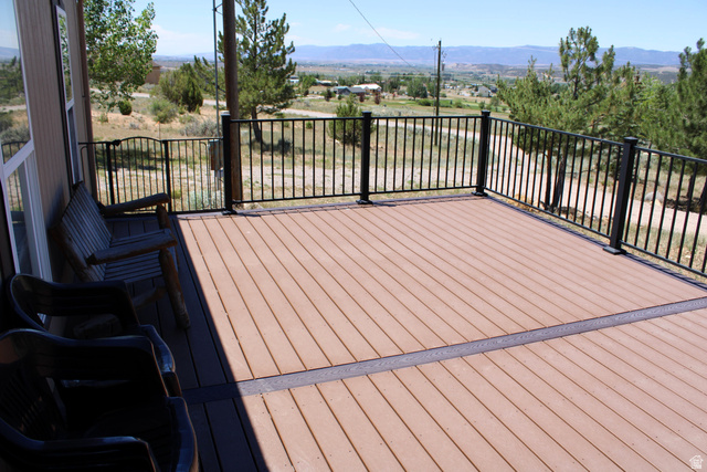 22580 Spring Creek Drive, Unit B61 Fairview, UT 84629 - Photo 6 of 39 Expansive composite deck featuring a two-tone plank design and black metal railings