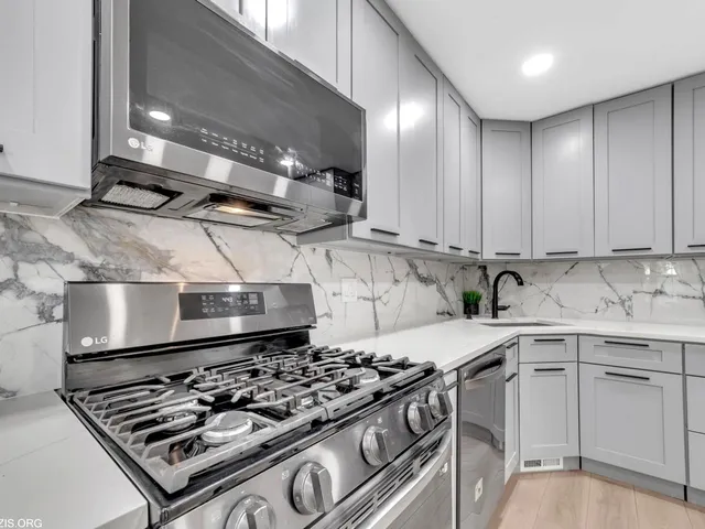 a kitchen with a stove and a sink