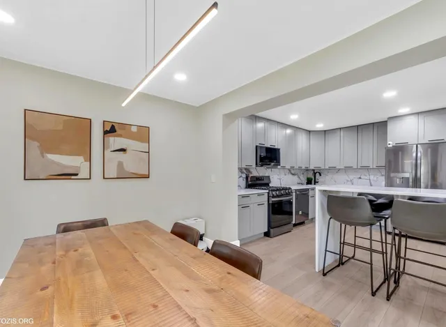 a kitchen with a sink cabinets and stainless steel appliances