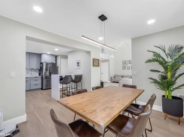 a dining room with furniture and window