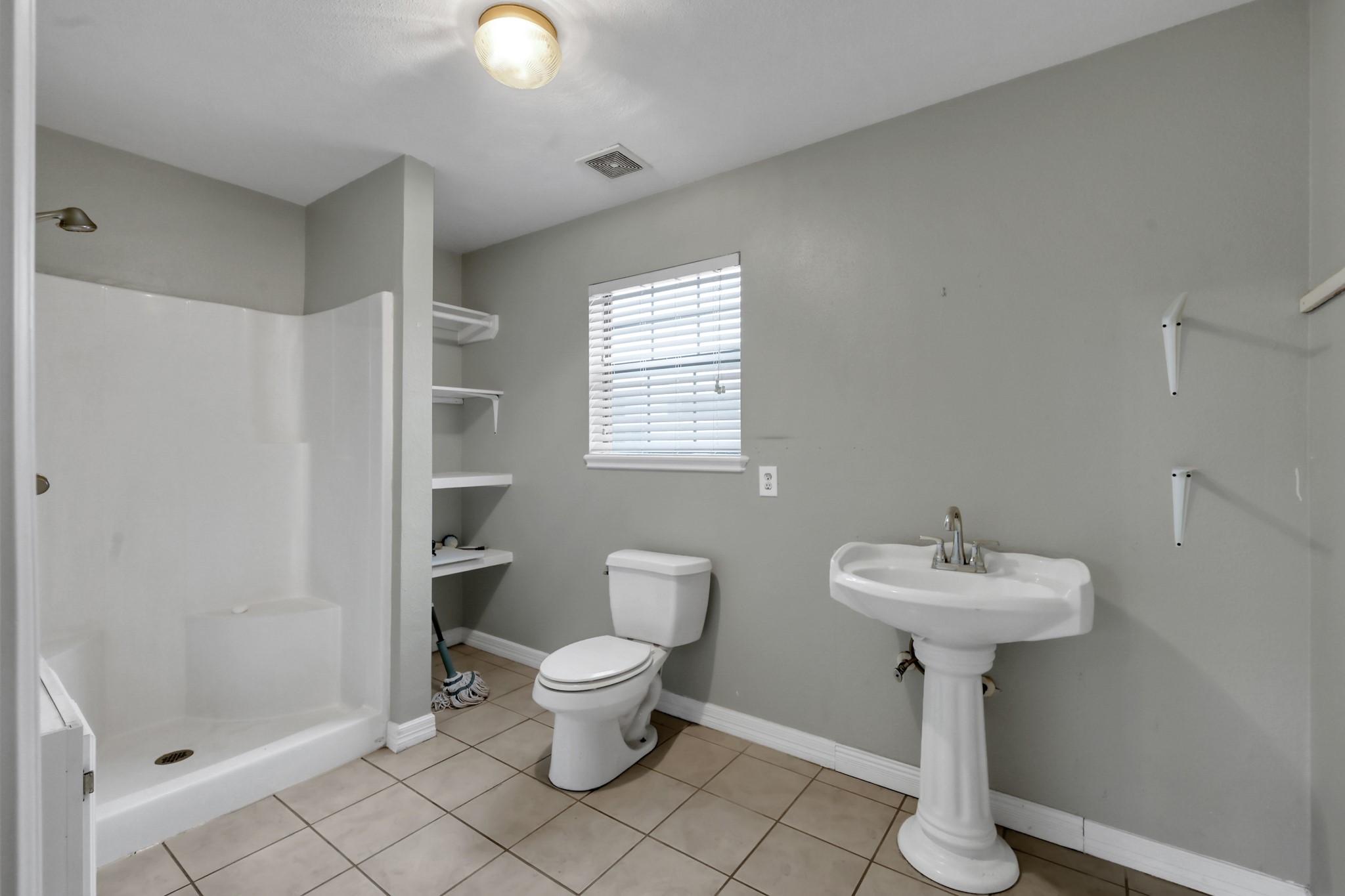 7644 Spring Cypress Road Spring, TX 77379 - Photo 14 of 28 a bathroom with a sink toilet and shower