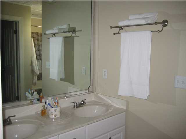 93 Mantero Way Destin, FL 32541 - Photo 12 of 21 a bathroom with a sink and a mirror