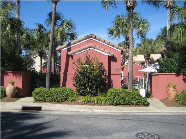 93 Mantero Way Destin, FL 32541 - Photo 18 of 21 a front view of a house with a garden
