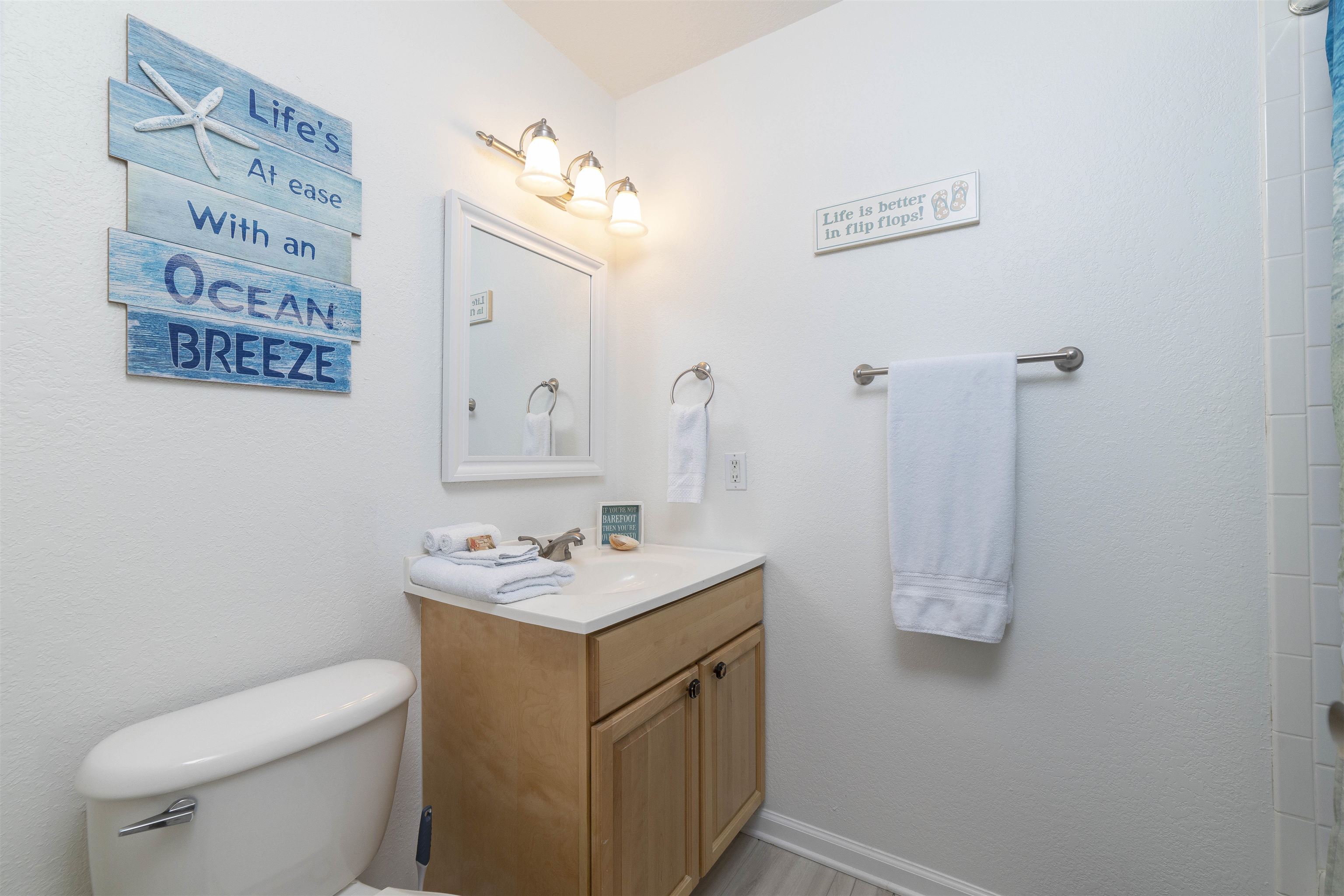 28 Schooner Court, Unit 28 St. Augustine, FL 32080 - Photo 21 of 28 a bathroom with a sink toilet and mirror