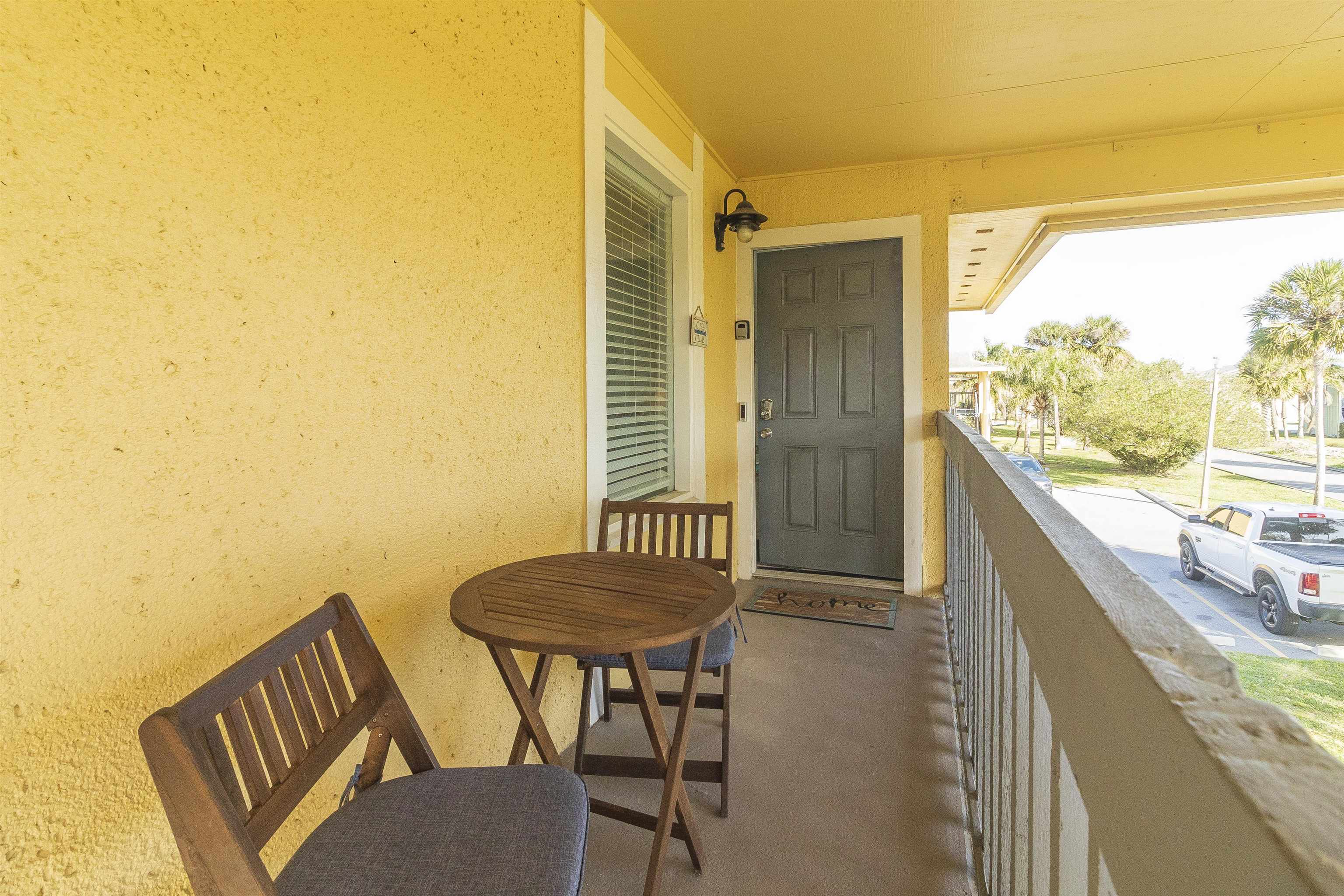 28 Schooner Court, Unit 28 St. Augustine, FL 32080 - Photo 3 of 28 a view of a balcony with furniture and next to a window
