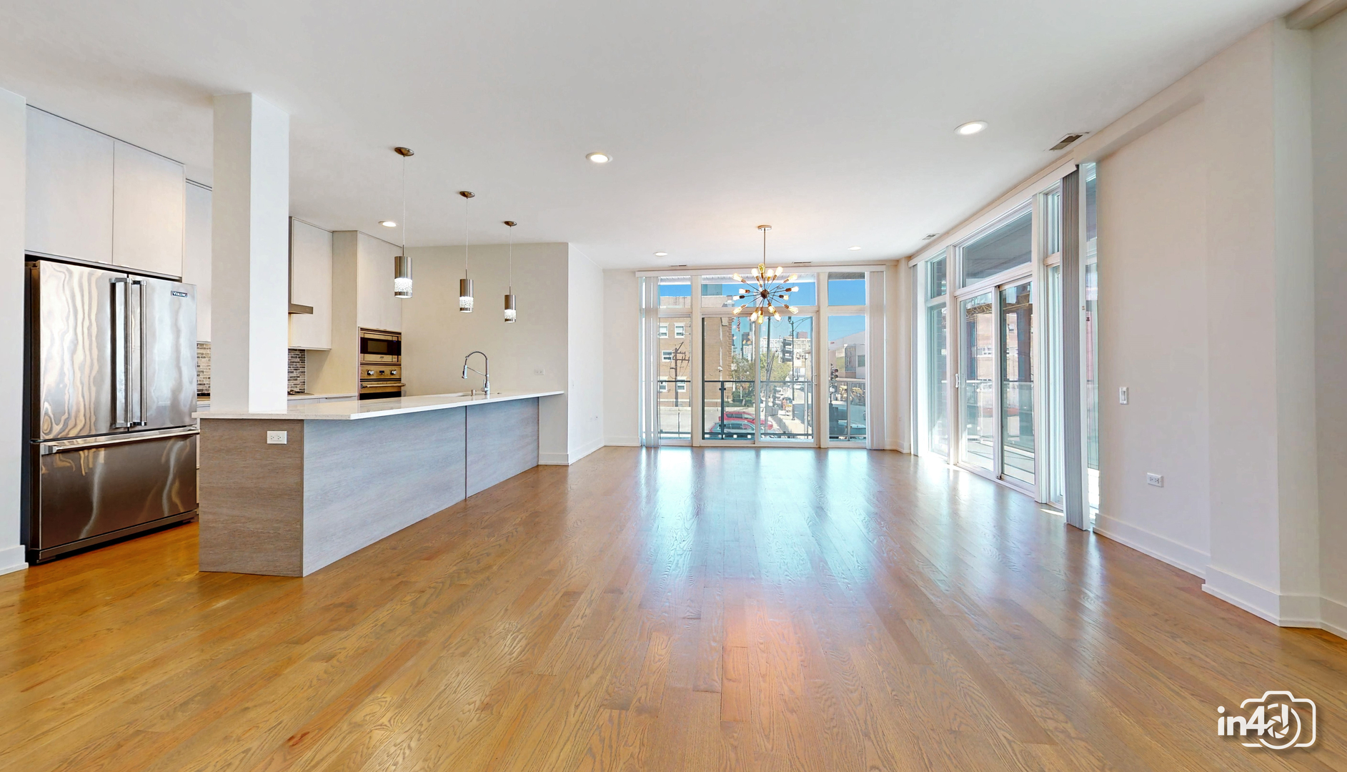 236 South Racine Avenue, Unit 201 Chicago, IL 60607 - Photo 13 of 45 a view of a kitchen with wooden floor and a kitchen